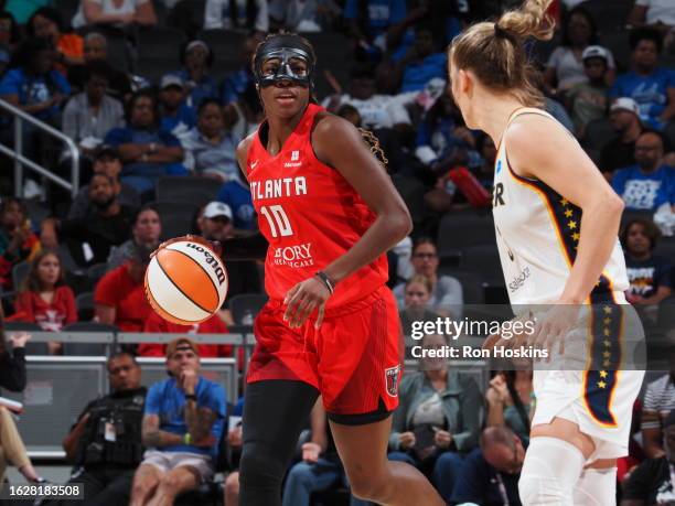 Rhyne Howard of the Atlanta Dream dribbles the ball during the game against the Indiana Fever on August 27, 2023 at Gainbridge Fieldhouse in...