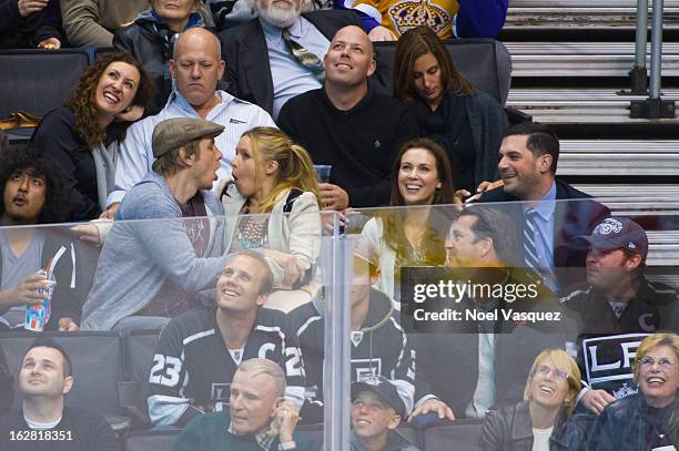 Dax Shepard, Kristen Bell, Alyssa Milano and David Bugliari attend a hockey game between the Detroit Red Wings and Los Angeles Kings at Staples...