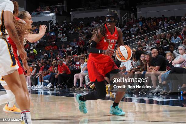 Rhyne Howard of the Atlanta Dream dribbles the ball during the game against the Indiana Fever on August 27, 2023 at Gainbridge Fieldhouse in...