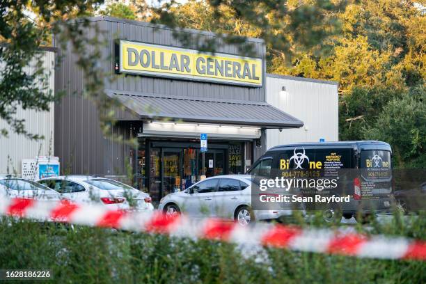 Biohazard cleanup vehicle is parked outside the Dollar General store where three people were shot and killed the day before on August 27, 2023 in...