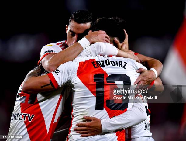 Pablo Solari of River Plate celebrates with teammates after scoring the team's third goal during a match between River Plate and Barracas Central as...
