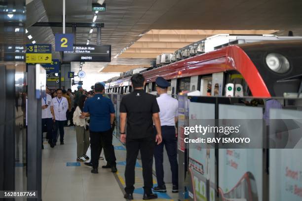 Series of LRT carriages, carrying President Joko Widodo, prepare to leave Cawang station in Jakarta on August 28 shortly after its inauguration for...