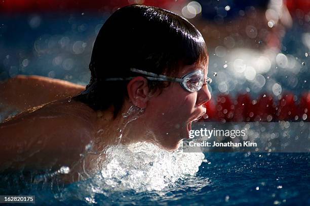 eleven year old boy competes in butterfly swim. - year in focus sport stockfoto's en -beelden