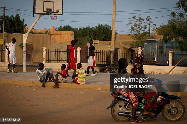 Young people play basketball at the former "Sharia Square" in central Gao on February 26, 2013. Since the departure of the Islamists, who occupied...