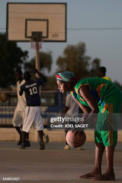Awa plays basketball at the former "Sharia Square" in central Gao on February 26, 2013. Since the departure of the Islamists, who occupied the city...