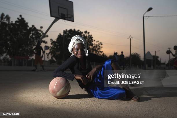Fati poses as she plays basketball at the former "Sharia Square" in central Gao on February 26, 2013. Since the departure of the Islamists, who...