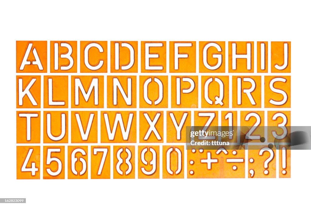 Alphabet and numbers, cut out on white background