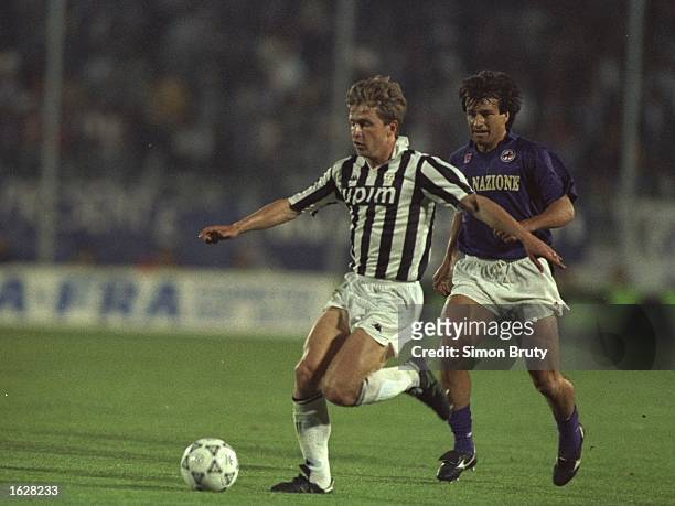 Giancarlo Marocchi of Juventus is pursued by Dunga of Fiorentina during the UEFA Cup Final second leg match in Avellino, Italy. The match ended in a...