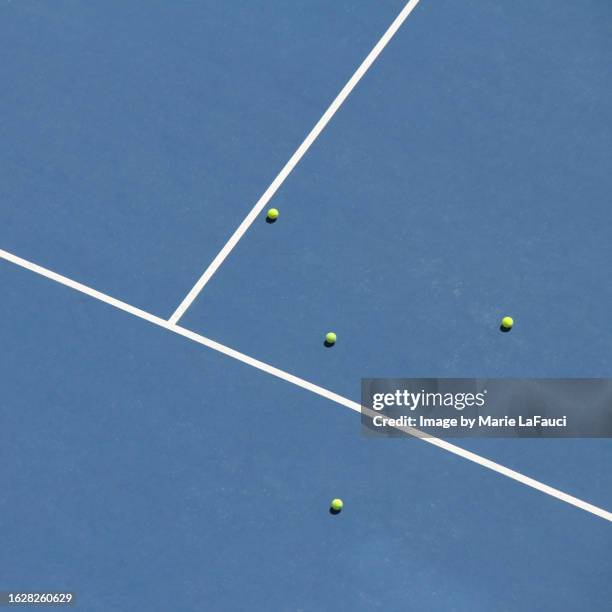 blue tennis court surface lines and tennis balls - blue tennis court stock pictures, royalty-free photos & images