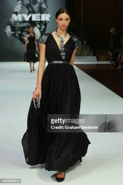 Model Alexandra Agoston showcases designs by Aurelio Costarella at the Myer Autumn/Winter 2013 collections launch at Mural Hall at Myer on February...
