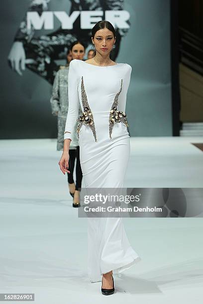 Model Alexandra Agoston showcases designs by Toni Maticevski at the Myer Autumn/Winter 2013 collections launch at Mural Hall at Myer on February 28,...