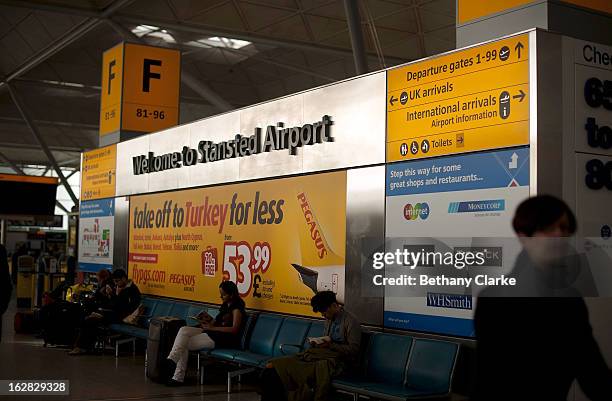 Travellers at Stansted Airport on February 28, 2013 in Bishop's Stortford, England. The deal between Heathrow Airport Holdings, formerly known as...