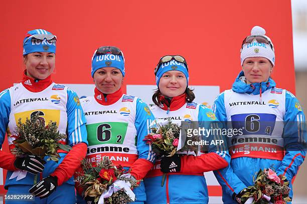 Russia's team Mariya Guschina, Alija Iksanova, Julia Ivanova, Yulia Tchekaleva pose on February 28, 2013 on the podium after winning bronze in the...
