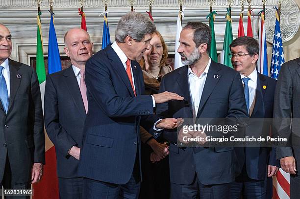 British Foreign Secretary William Hague, US Secretary of State John Kerry, Syrian opposition's National Coalition chief Ahmed Moaz al-Khatib and...