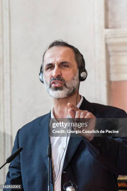 Syrian opposition's National Coalition chief Ahmed Moaz al-Khatib gestures as he talks during a press conference after the meeting of the 'Friends of...