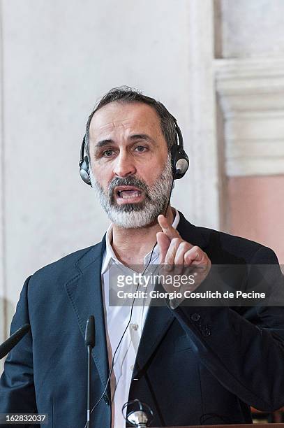 Syrian opposition's National Coalition chief Ahmed Moaz al-Khatib gestures as he talks during a press conference after the meeting of the 'Friends of...