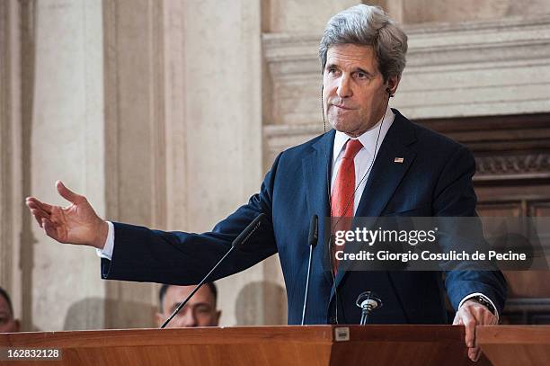 Secretary of State John Kerry gestures as he speaks during a press conference after attending the meeting of the 'Friends of the Syrian People' at...