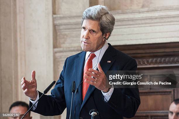 Secretary of State John Kerry gestures as he speaks during a press conference after attending the meeting of the 'Friends of the Syrian People' at...