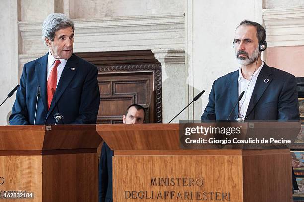 Syrian opposition's National Coalition chief Ahmed Moaz al-Khatib and US Secretary of State John Kerry attend a press conference after the meeting of...