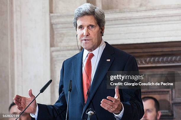 Secretary of State John Kerry gestures as he speaks during a press conference after attending the meeting of the 'Friends of the Syrian People' at...