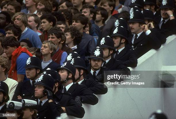 Metropolitan police stand on the steps at the edge of the crowd during a Tottenham Hotspur match at White Hart Lane in London. \ Mandatory Credit:...