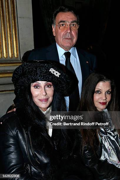 Cher, Balmain CEO Alain Hivelin and guest attend the Balmain Fall/Winter 2013 Ready-to-Wear show as part of Paris Fashion Week on February 28, 2013...