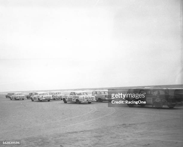 February 26, 1956: Drivers head north on the beach as they prepare for the start of the NASCAR Cup race on the Daytona Beach-Road Course. Pictured...