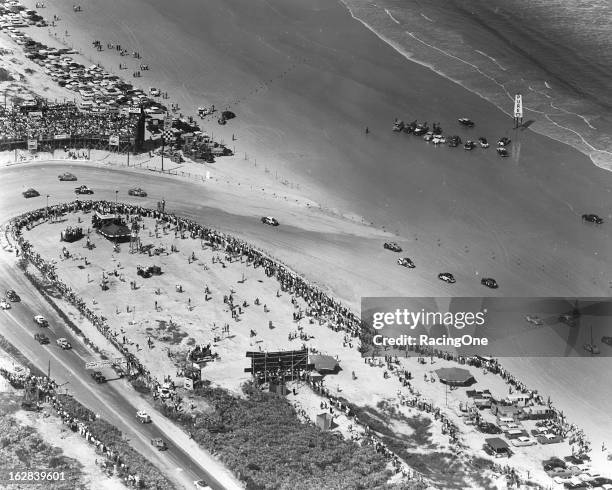 February 15, 1957: An aerial photo of action in the north turn of the Daytona Beach-Road Course during the NASCAR Modified race.