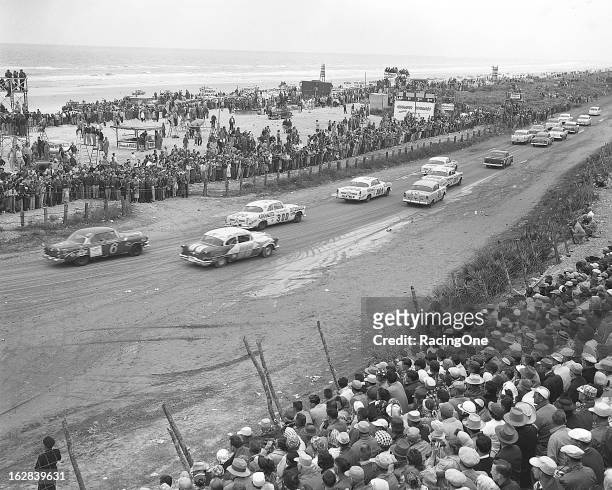 February 26, 1956: Cars turn south onto Highway A1A during the pace lap for the NASCAR Cup race on the Daytona Beach-Road Course. Getting ready for...