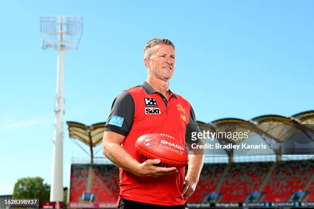 Damien Hardwick poses for a photo after a Gold Coast Suns AFL press conference announcing the signing of their new coach at Heritage Stadium on...