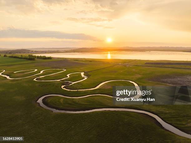 aerial view of meandering winding river in meadows - prairie creek stock pictures, royalty-free photos & images