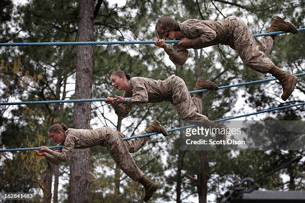 Female Marine recruits navigate an obstacle on the Confidence Course during boot camp February 27, 2013 at MCRD Parris Island, South Carolina. Female...