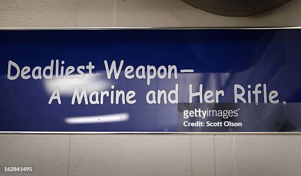 Sign hangs above the dining area in the chow hall where female Marine recruits eat during boot camp February 27, 2013 at MCRD Parris Island, South...