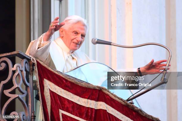 Pope Benedict XVI waves to pilgrims, for the last time as head of the Catholic Church, from the window of Castel Gandolfo where he will start his...