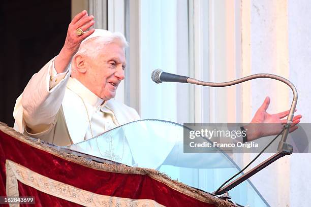 Pope Benedict XVI waves to pilgrims, for the last time as head of the Catholic Church, from the window of Castel Gandolfo where he will start his...