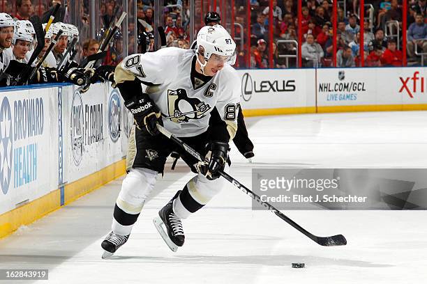 Sidney Crosby of the Pittsburgh Penguins skates with the puck against the Florida Panthers at the BB&T Center on February 26, 2013 in Sunrise,...