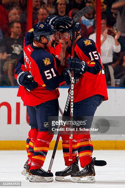Brian Campbell of the Florida Panthers celebrates a goal with teammate Drew Shore against the Pittsburgh Penguins at the BB&T Center on February 26,...