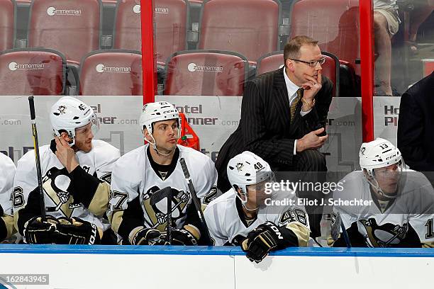 Head Coach Dan Bylsma of the Pittsburgh Penguins watches the action from the bench against the Florida Panthers at the BB&T Center on February 26,...