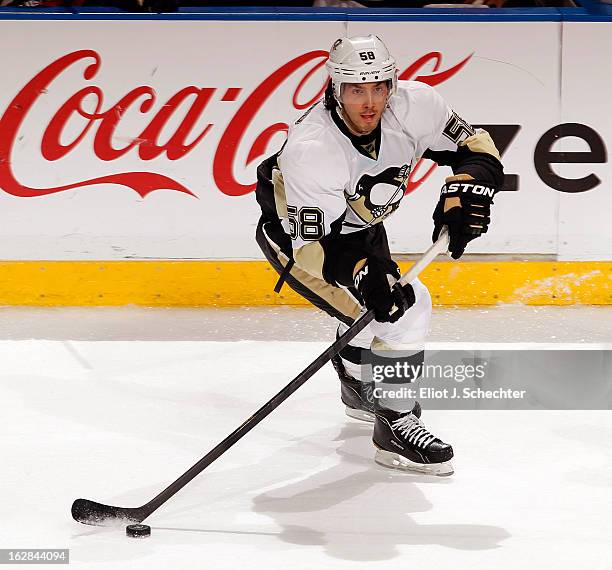 Kris Letang of the Pittsburgh Penguins skates with the puck against the Florida Panthers at the BB&T Center on February 26, 2013 in Sunrise, Florida.