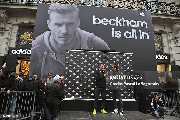 David Beckham addresses fans as he attends an autograph session at adidas Performance Store Champs-Elysees on February 28, 2013 in Paris, France.