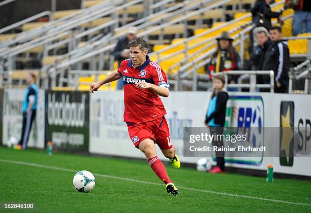 Logan Pause of the Chicago Fire looks to pass against the Vancouver Whitecaps FC during the first half of the Carolina Challenge Cup at Blackbaud...