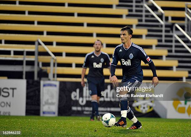 Alain Rochat of the Vancouver Whitecaps FC looks to pass during the first half of the Carolina Challenge Cup against the Chicago Fire at Blackbaud...