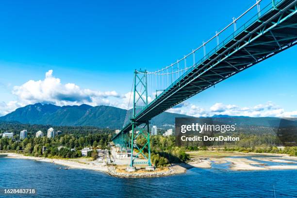 the view of west vancouver and lions gate bridge, vancouver, canada - vancouver lions gate stockfoto's en -beelden