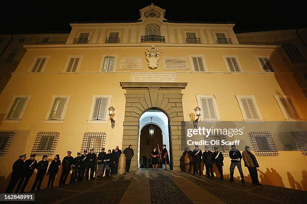 Members of the Swiss Guard prepare to close the doors to Pope Benedict XVI's residence in Castel Gandolfo and transfer responsibility for his...