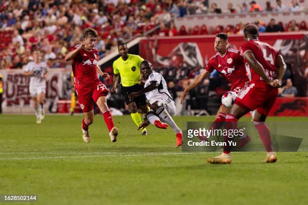 Christian Benteke of D.C. United shoots the ball during the second half against the New York Red Bulls at Red Bull Arena on August 20, 2023 in...