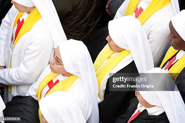 Nuns pray in the main Square of Castel Gandolfo prior to Pope Benedict XVI last appearance at the Balcony of the Apostolic Palace, for the last time...