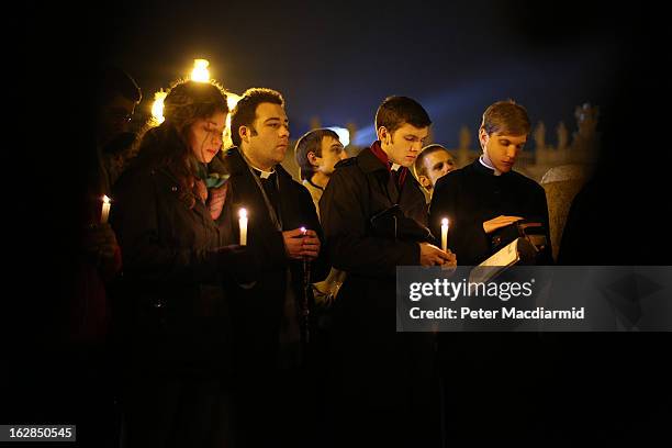 Group say prayers in St Peter's Square for Pope Benedict XVI in the moments before he ceased to be Pontiff at 20:00 CET on February 28, 2013 in...