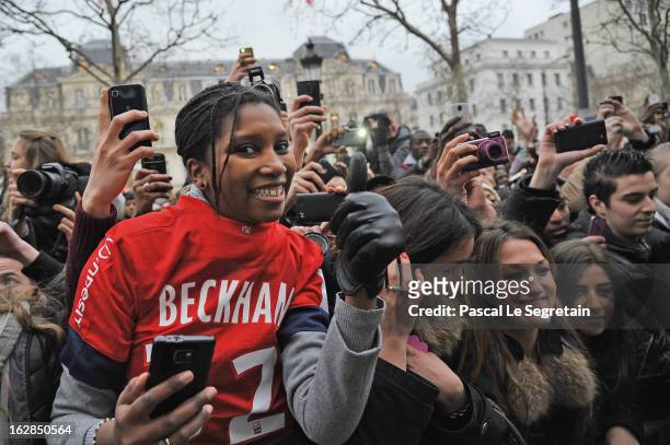 Fans try to get a glance at David Beckham attending an autograph session at adidas Performance Store Champs-Elysees on February 28, 2013 in Paris,...