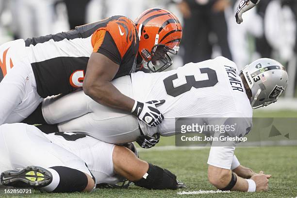 Robert Geathers of the Cincinnati Bengals puts a hit on Carson Palmer of the Oakland Raiders during their game at Paul Brown Stadium on November 25,...