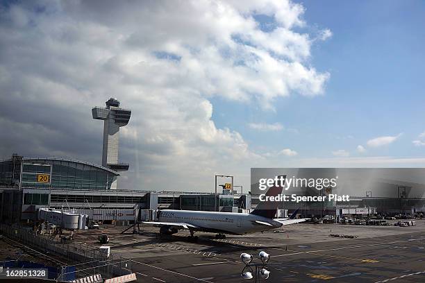 Plane waits at John F. Kennedy Airport on February 28, 2013 in New York City. Should the $85 billion in automatic federal budget cuts, known as the...